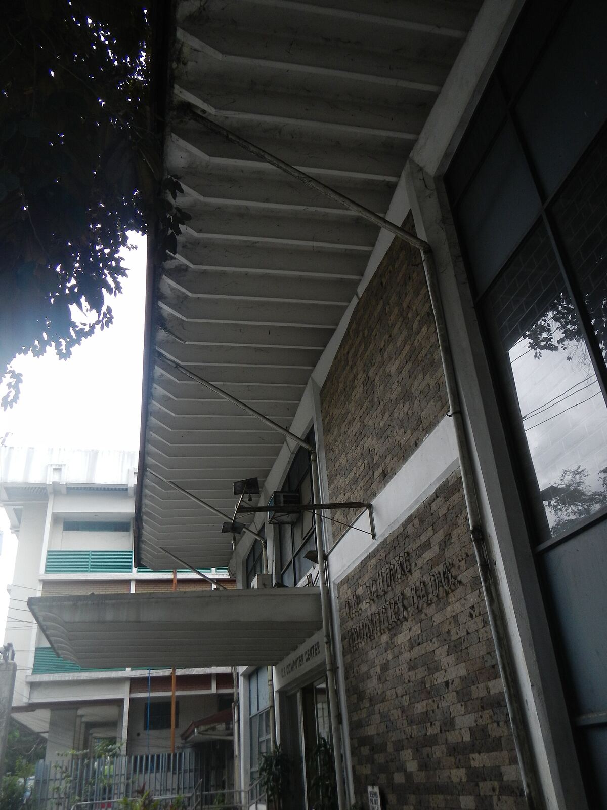 University of the Philippines Computer Center [1] The U.P. Computer Center is an independent unit of the Diliman campus [2] of the University of the Philippines [3] that provides high-speed computer and information technology services to the University faculty, administration and students. It is now under the Office of the Chancellor of UP Diliman It is housed in the UP Alumni Engineers (UPAE) Building at the back of the Melchor Hall compound. Also called the UP CC (or CC for short), the facility serves as the central hub that interconnects the fiber-optic backbones in UP Diliman and other UP campuses. The center is also the hub of the UP Diliman Wireless Network, which has over 100 WiFi Hot Spots deployed all over the campus as of 2011. The center is administered by a member of the faculty and manned by full-time employees and student assistants. Its current director is Dr. Johnrob Y. Bantang from the National Institute of Physics. [4] [5] The Computer Center and its staff during the 1970s The University Computer Center was established in September 15, 1966 by the University of the Philippines In 2011, the University Computer Center implemented the largest IPv6 network and one of the first in the country. The University Computer Center in Diliman maintains one of the largest campus networks in the country, having laid more than 50 kilometers of fiber optic cables, deploying over 100 wireless hotspots, 1024 Voice over IP (VoIP) phones, and hosting around 80 UP websites through its servers. University Computer Center is divided into 3 units namely: Administrative Unit Data Processing Unit Network and Systems Operation Unit [6] Coordinates: 14°39'26"N 121°4'12"E [7] [8]