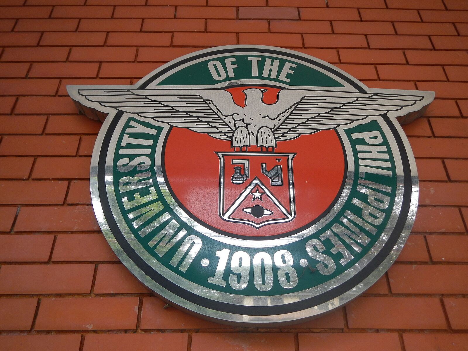 University of the Philippines Computer Center [1] The U.P. Computer Center is an independent unit of the Diliman campus [2] of the University of the Philippines [3] that provides high-speed computer and information technology services to the University faculty, administration and students. It is now under the Office of the Chancellor of UP Diliman It is housed in the UP Alumni Engineers (UPAE) Building at the back of the Melchor Hall compound. Also called the UP CC (or CC for short), the facility serves as the central hub that interconnects the fiber-optic backbones in UP Diliman and other UP campuses. The center is also the hub of the UP Diliman Wireless Network, which has over 100 WiFi Hot Spots deployed all over the campus as of 2011. The center is administered by a member of the faculty and manned by full-time employees and student assistants. Its current director is Dr. Johnrob Y. Bantang from the National Institute of Physics. [4] [5] The Computer Center and its staff during the 1970s The University Computer Center was established in September 15, 1966 by the University of the Philippines In 2011, the University Computer Center implemented the largest IPv6 network and one of the first in the country. The University Computer Center in Diliman maintains one of the largest campus networks in the country, having laid more than 50 kilometers of fiber optic cables, deploying over 100 wireless hotspots, 1024 Voice over IP (VoIP) phones, and hosting around 80 UP websites through its servers. University Computer Center is divided into 3 units namely: Administrative Unit Data Processing Unit Network and Systems Operation Unit [6] Coordinates: 14°39'26"N 121°4'12"E [7] [8]